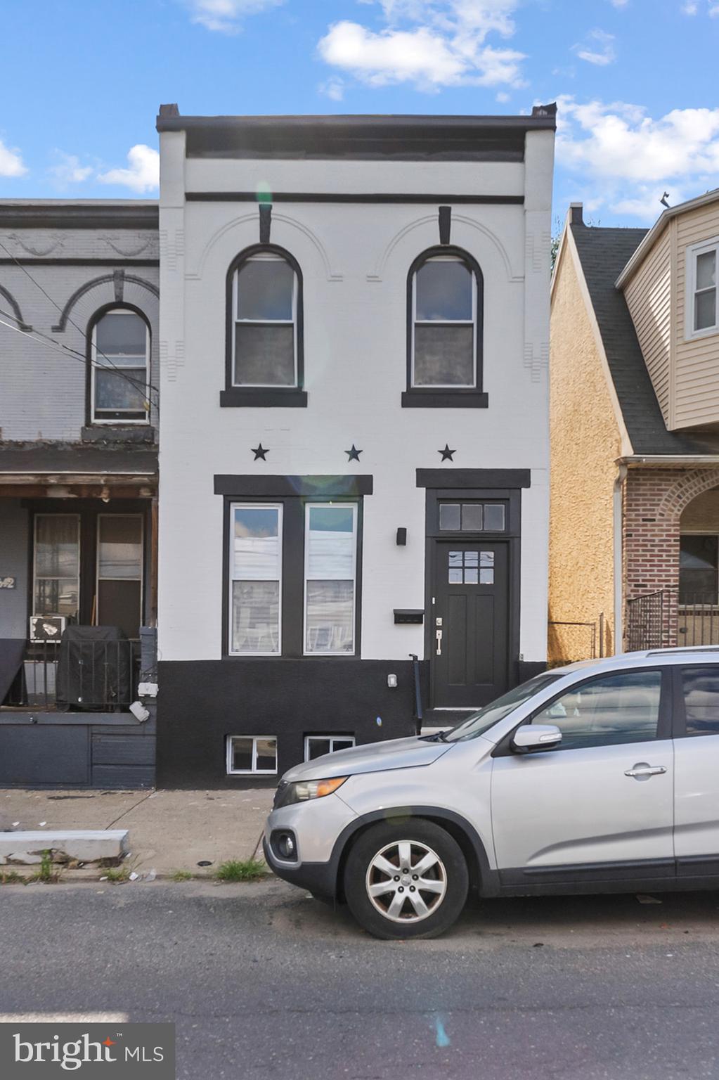 1644 North 6th Street Philadelphia, PA 19122 - Photo 1 of 52 a front view of a house with parking space