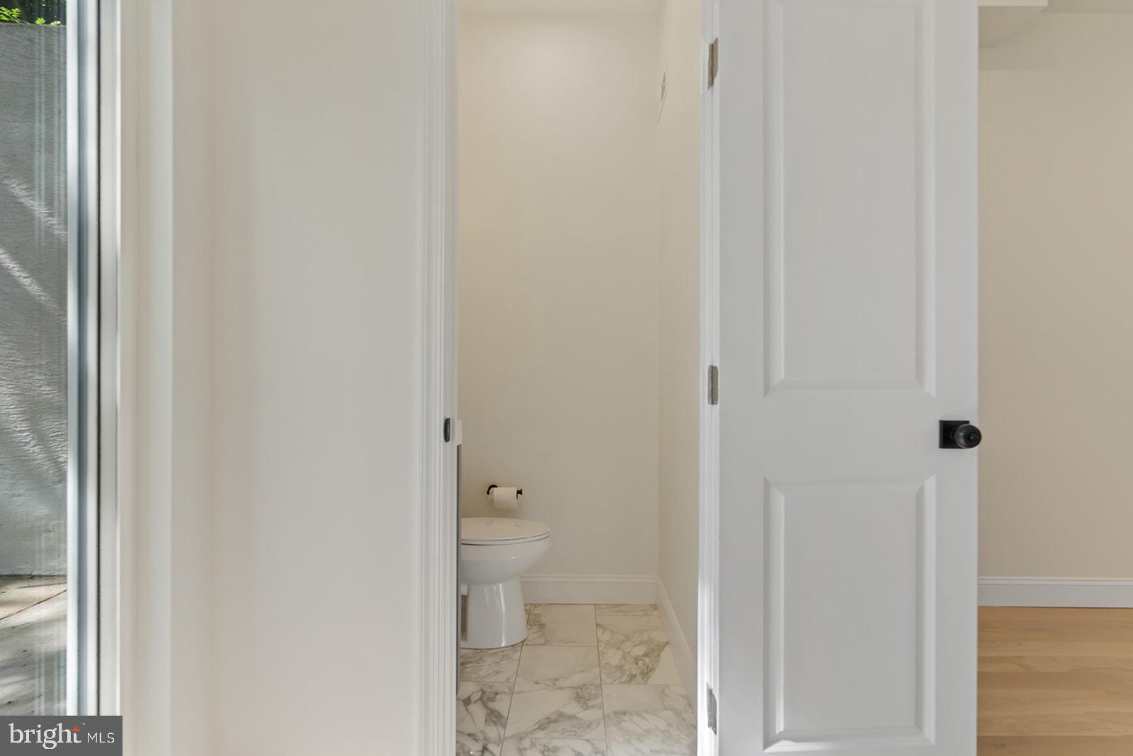 1644 North 6th Street Philadelphia, PA 19122 - Photo 22 of 52 a bathroom with a granite countertop toilet and a shower