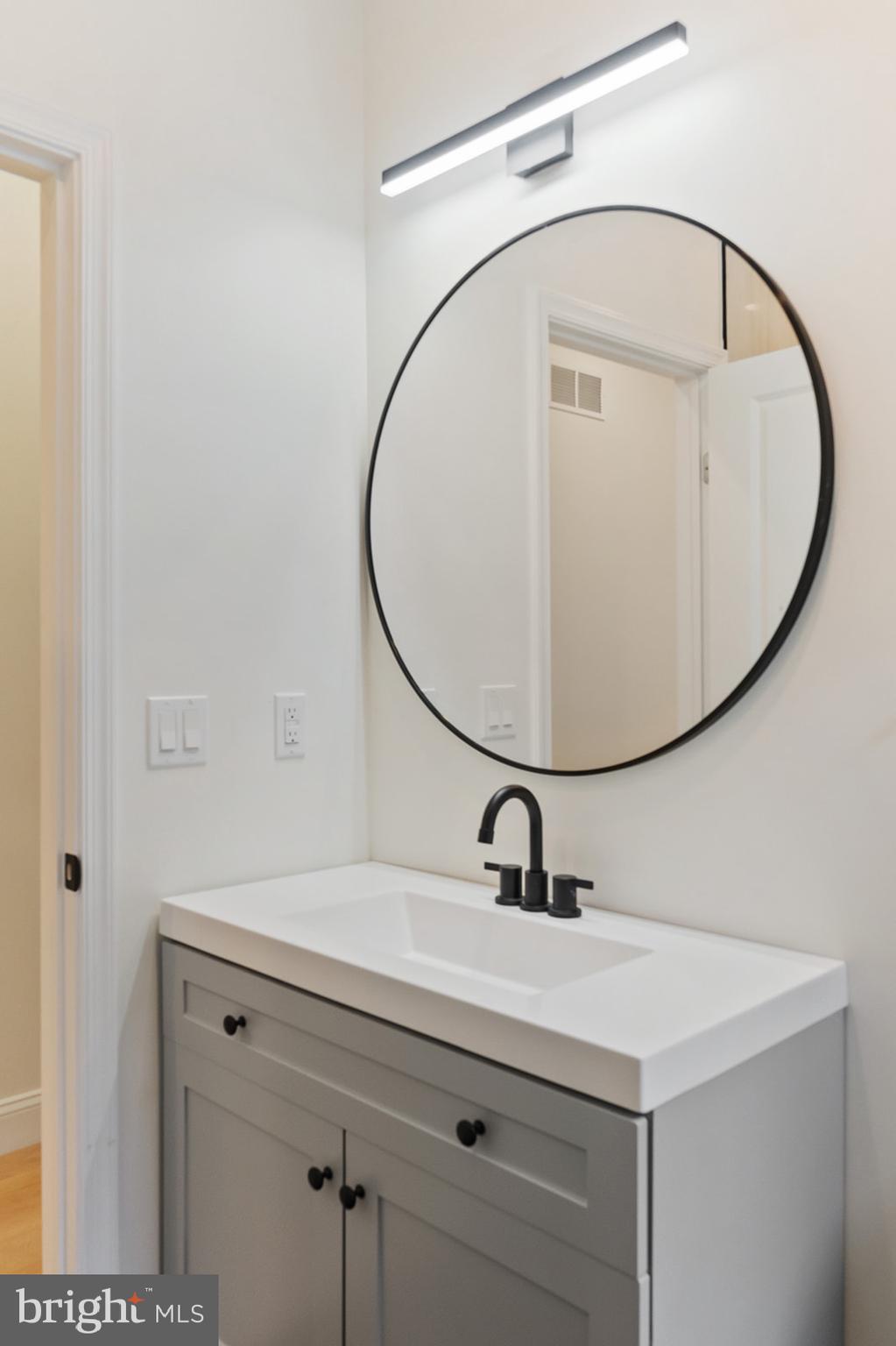 1644 North 6th Street Philadelphia, PA 19122 - Photo 29 of 52 a bathroom with a sink and mirror