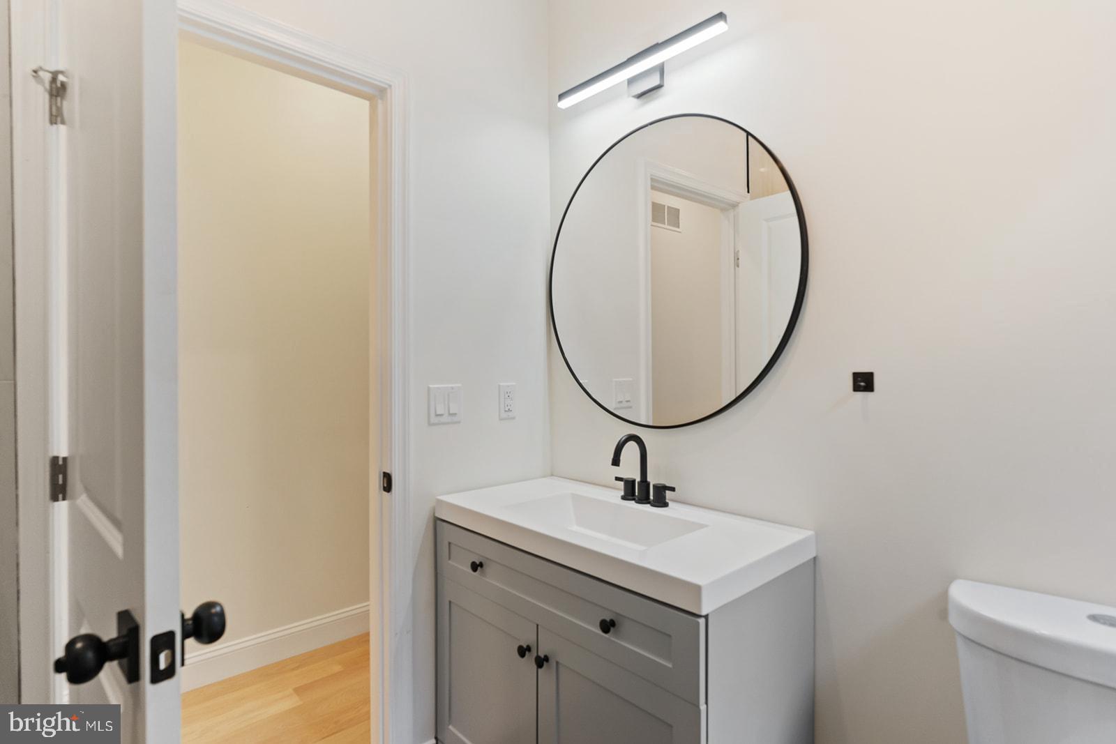 1644 North 6th Street Philadelphia, PA 19122 - Photo 30 of 52 a bathroom with a sink and a mirror