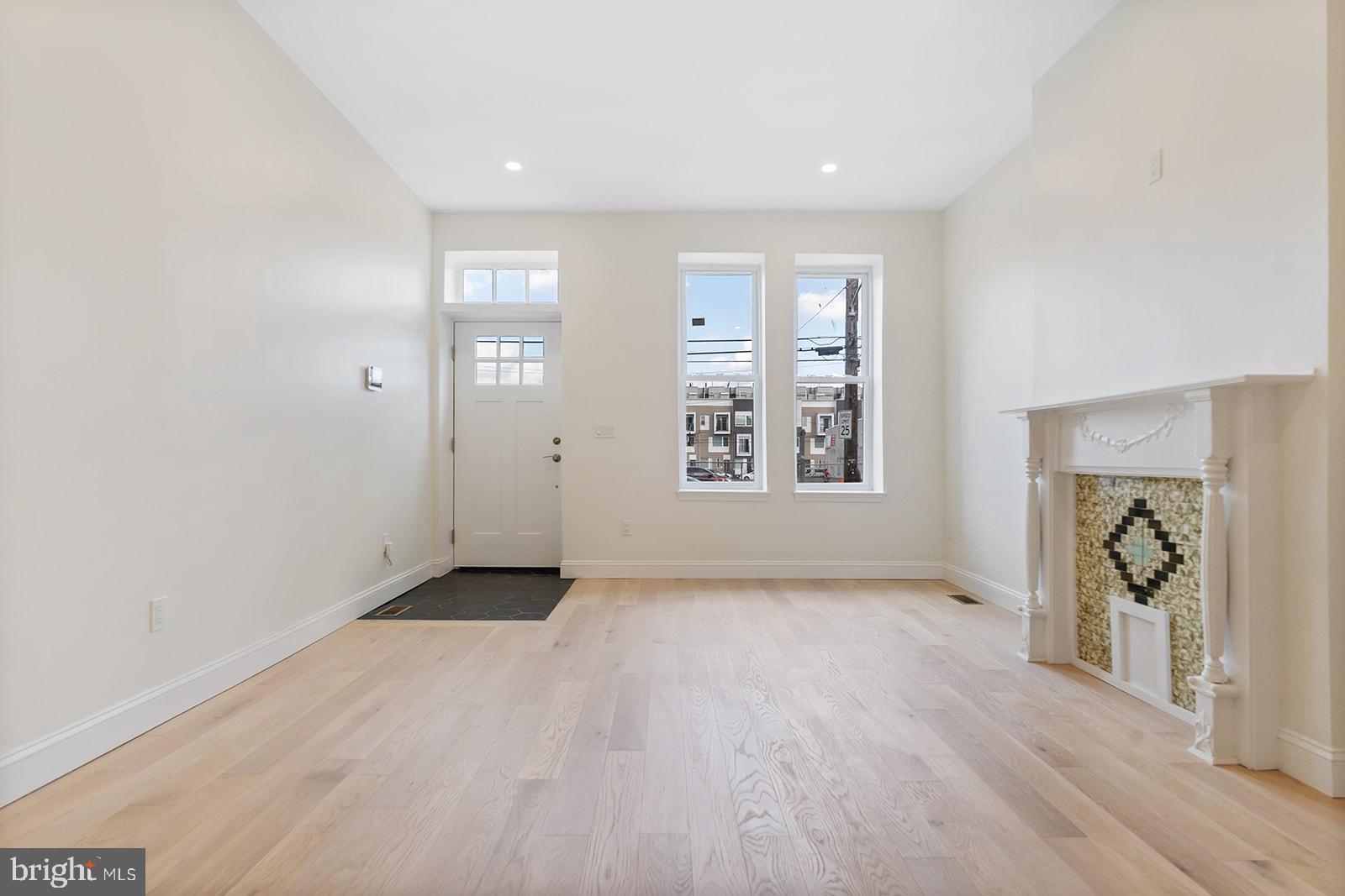 1644 North 6th Street Philadelphia, PA 19122 - Photo 3 of 52 an empty room with window and wooden floor