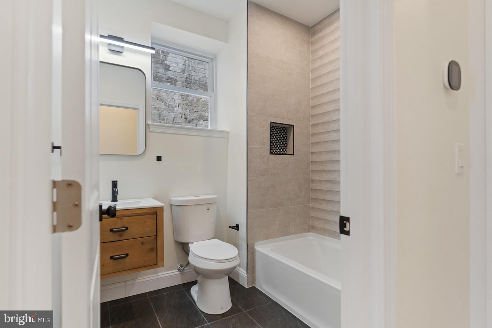 1644 North 6th Street Philadelphia, PA 19122 - Photo 39 of 52 a bathroom with a toilet and a bathtub