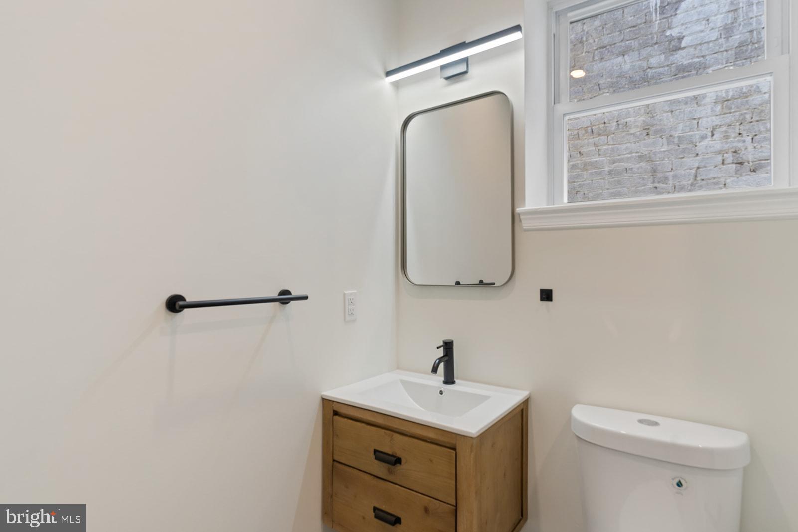 1644 North 6th Street Philadelphia, PA 19122 - Photo 41 of 52 a bathroom with a toilet sink and mirror