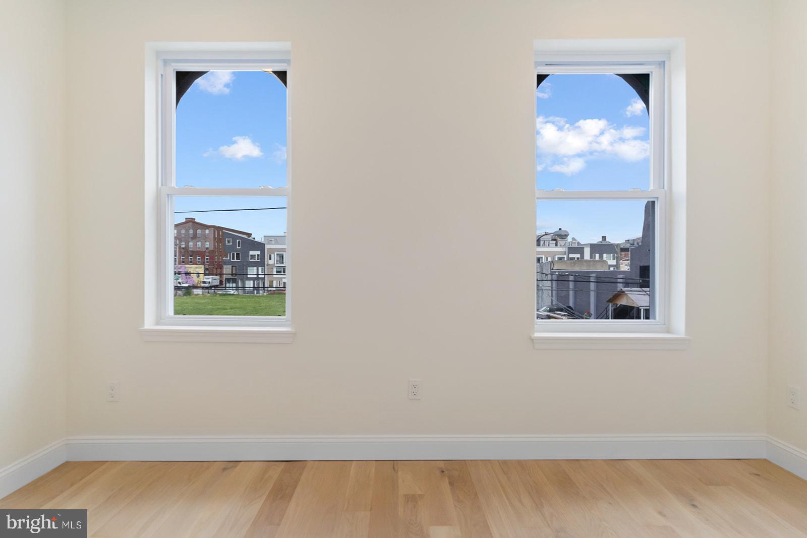 1644 North 6th Street Philadelphia, PA 19122 - Photo 45 of 52 an empty room with a window and a potted plant