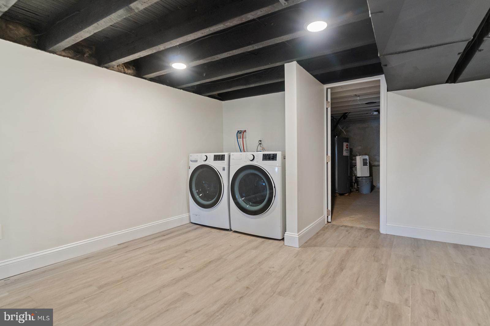 1644 North 6th Street Philadelphia, PA 19122 - Photo 49 of 52 a utility room with wooden floor washer and dryer