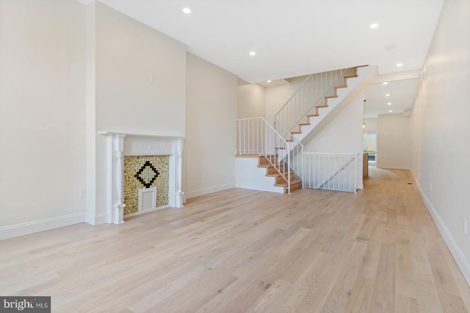 1644 North 6th Street Philadelphia, PA 19122 - Photo 7 of 52 a view of empty room with stairs and wooden floor