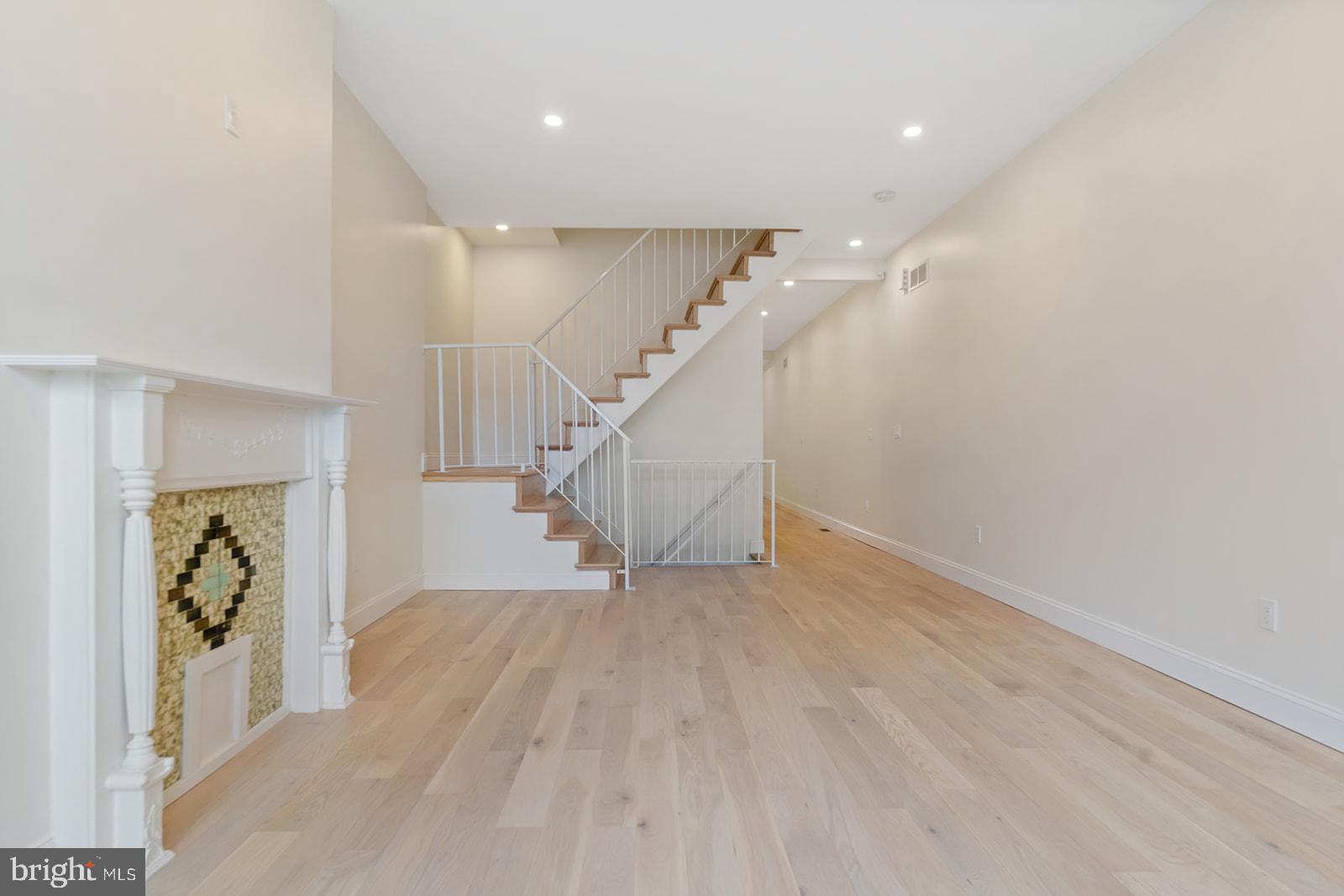 1644 North 6th Street Philadelphia, PA 19122 - Photo 8 of 52 a view of entryway and hall with wooden floor