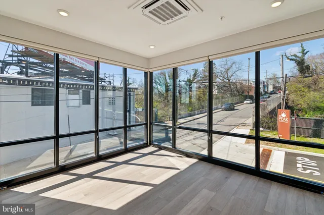 a view of a living room with a large window
