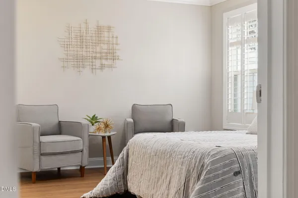 a bedroom with bed and window