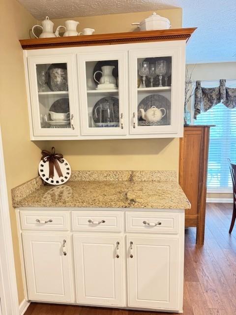 25 Browning Shoals Road Social Circle, GA 30025 - Photo 15 of 47 a view of granite countertop cabinets and wooden floor