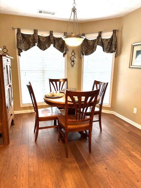 25 Browning Shoals Road Social Circle, GA 30025 - Photo 17 of 47 a view of a dining room with furniture and wooden floor