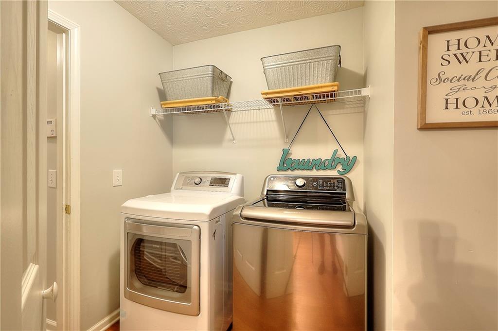 25 Browning Shoals Road Social Circle, GA 30025 - Photo 18 of 47 a utility room with dryer and washer