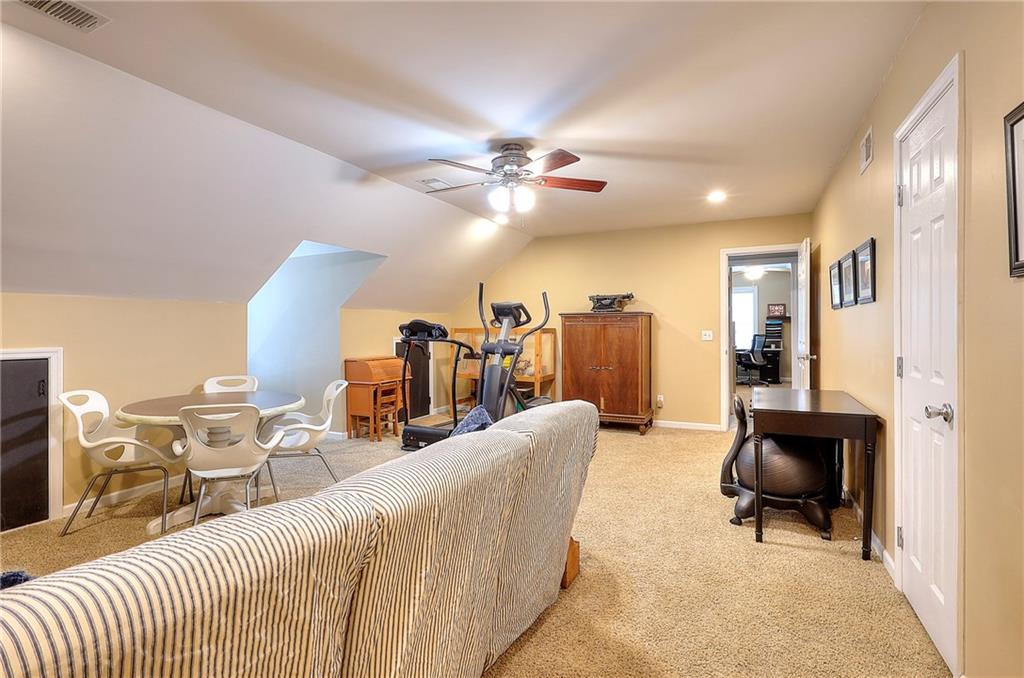 25 Browning Shoals Road Social Circle, GA 30025 - Photo 29 of 47 a living room with furniture and wooden floor
