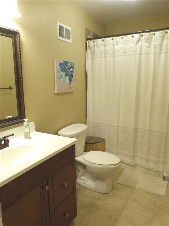 25 Browning Shoals Road Social Circle, GA 30025 - Photo 32 of 47 a bathroom with a double vanity sink and a mirror