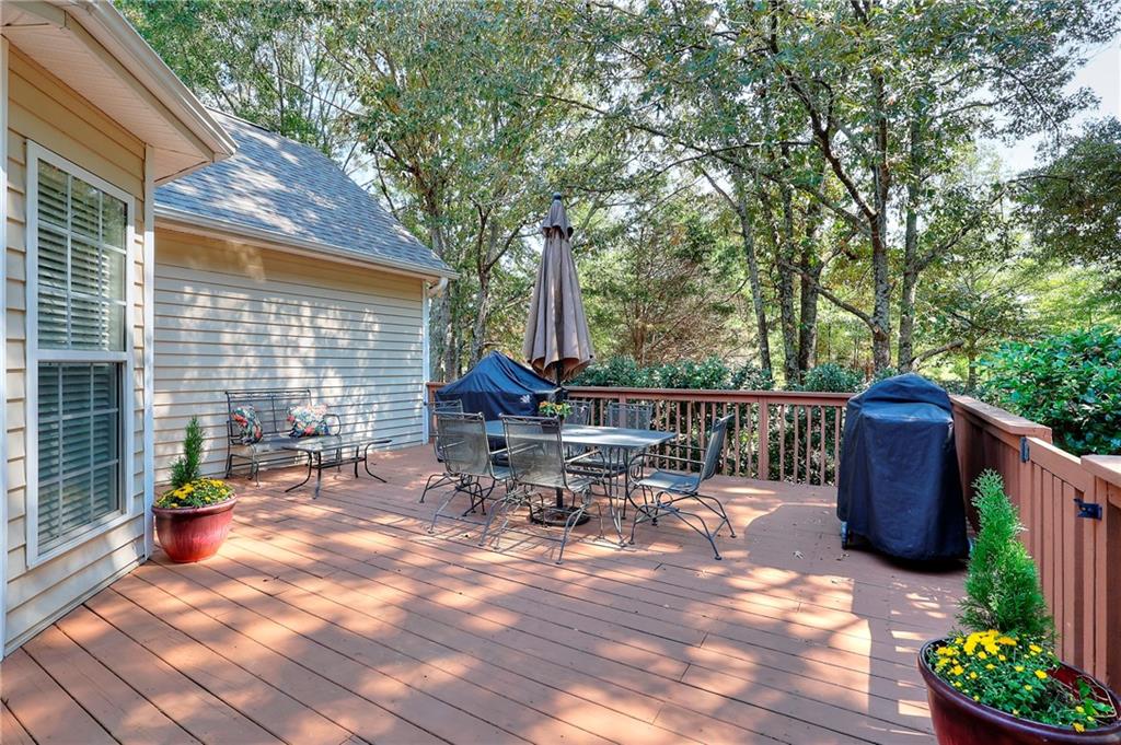 25 Browning Shoals Road Social Circle, GA 30025 - Photo 35 of 47 a view of a patio with a table and chairs