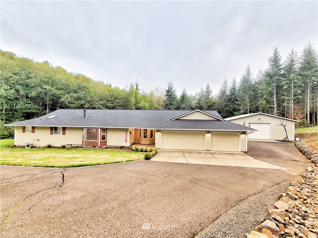 317 Grasseth Poston Road Longview, WA 98632 - Photo 1 of 36 a house with trees in the background