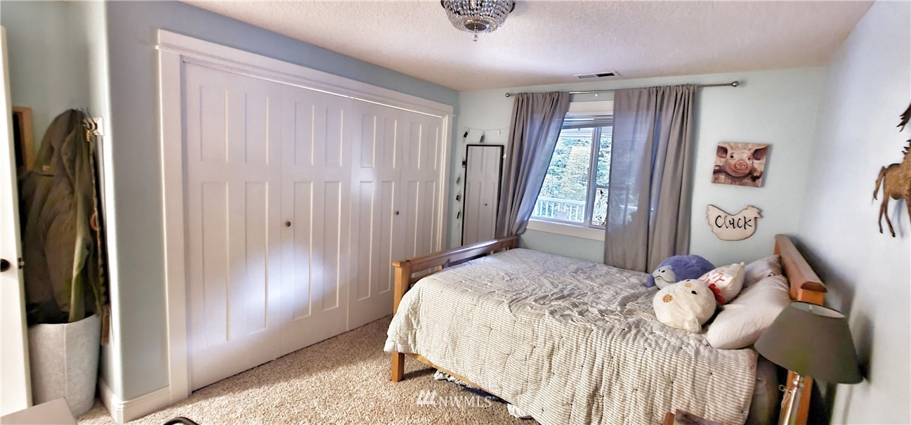 317 Grasseth Poston Road Longview, WA 98632 - Photo 14 of 36 a bedroom with a bed and a window