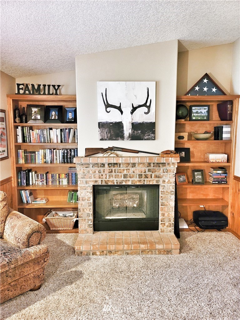 317 Grasseth Poston Road Longview, WA 98632 - Photo 22 of 36 a living room with furniture and a fireplace