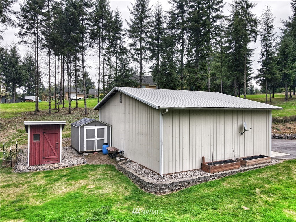317 Grasseth Poston Road Longview, WA 98632 - Photo 29 of 36 a front view of a house with a garden and yard