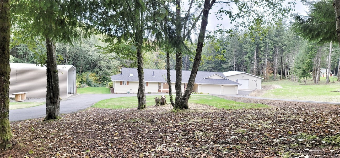 317 Grasseth Poston Road Longview, WA 98632 - Photo 36 of 36 a view of a house with backyard and trees