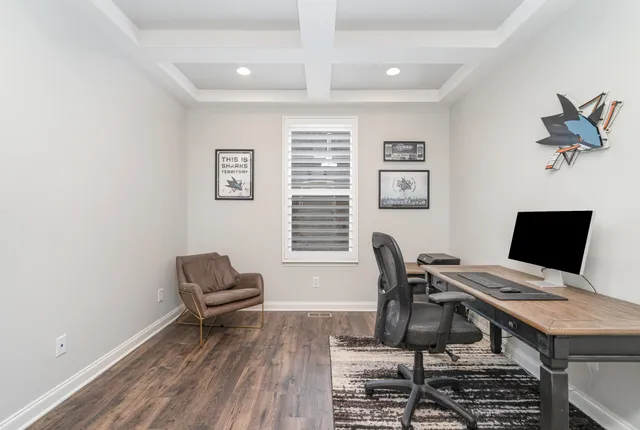 a workspace with furniture and a window