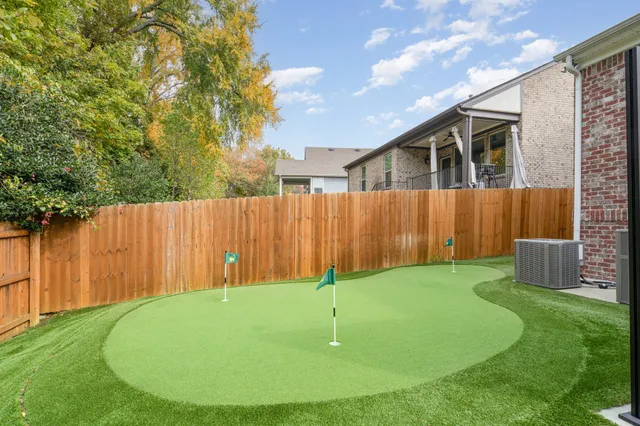 a view of a backyard with a small cabin