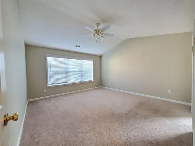 a large bathroom with a large tub and sink