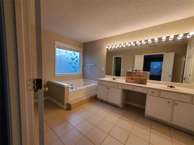 a room with a mirror and a sink