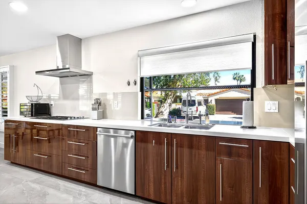 a kitchen with a sink and wooden cabinets