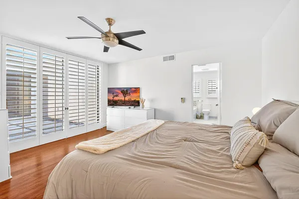 a bathroom with a granite countertop toilet a sink and a bathtub