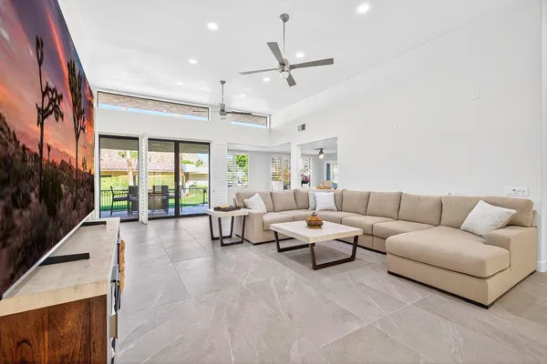 a living room with furniture and a large window