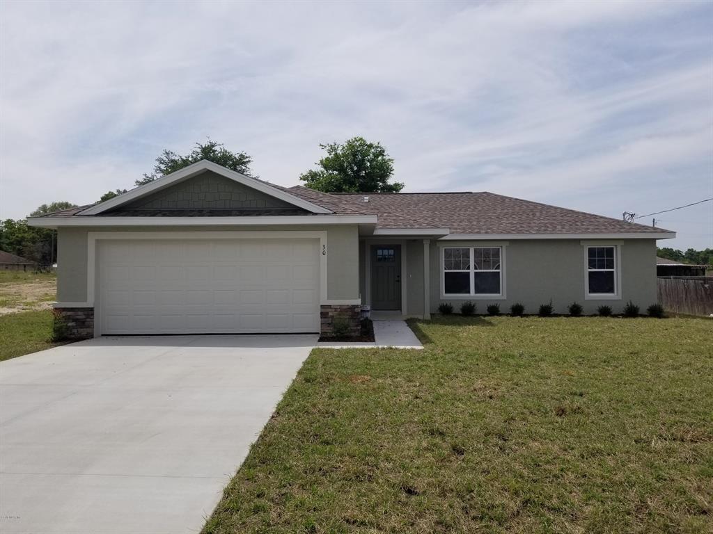 72 Pecan Course Loop Ocala, FL 34472 - Photo 1 of 1 front view of a house with a yard