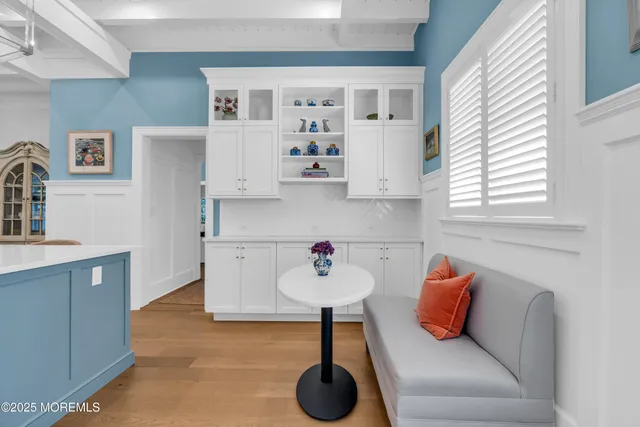 a kitchen with stainless steel appliances a white center island and a sink