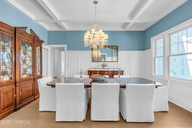 a living room with furniture and cabinets