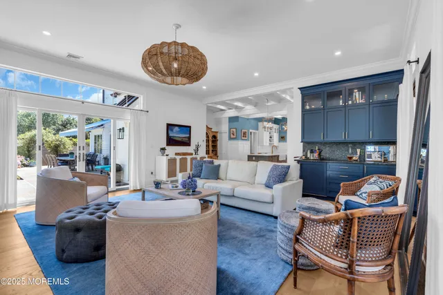 a living room with furniture and a dresser