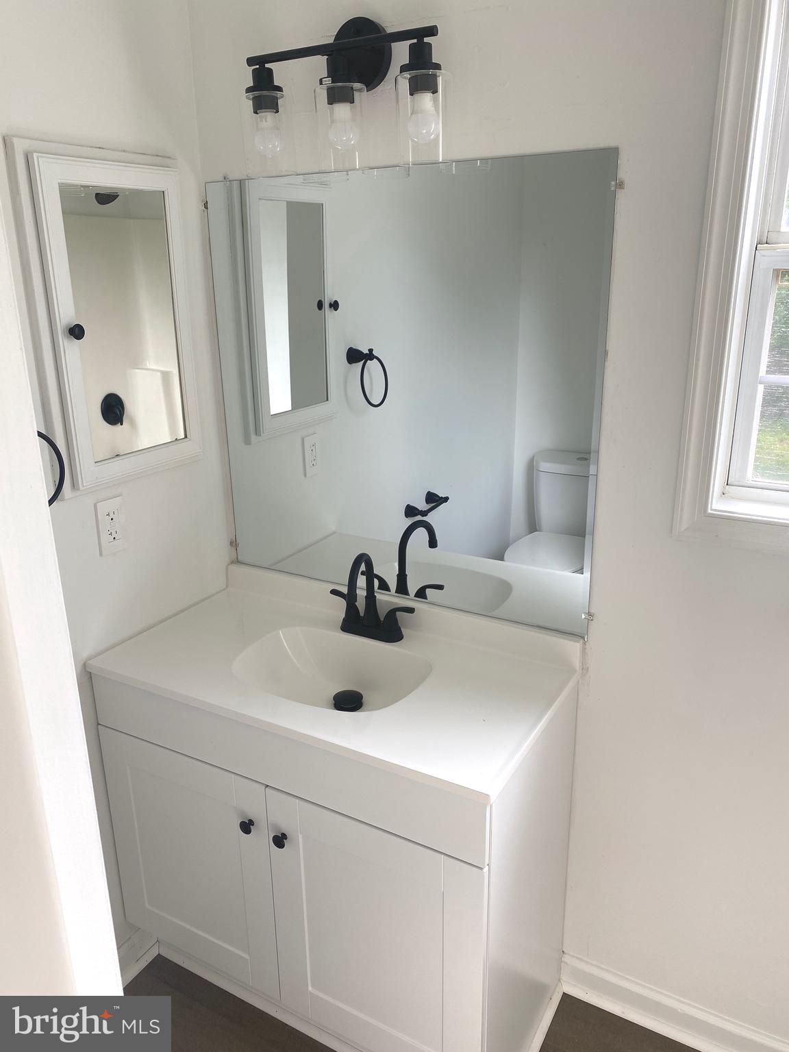 172 Jack Rabbit Lane Ranson, WV 25438 - Photo 24 of 34 a bathroom with a sink and a mirror