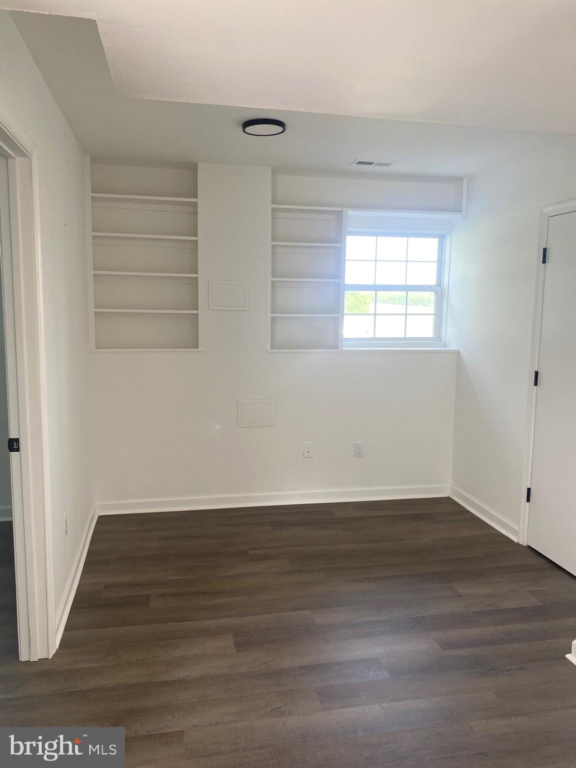 172 Jack Rabbit Lane Ranson, WV 25438 - Photo 28 of 34 an empty room with wooden floor and windows