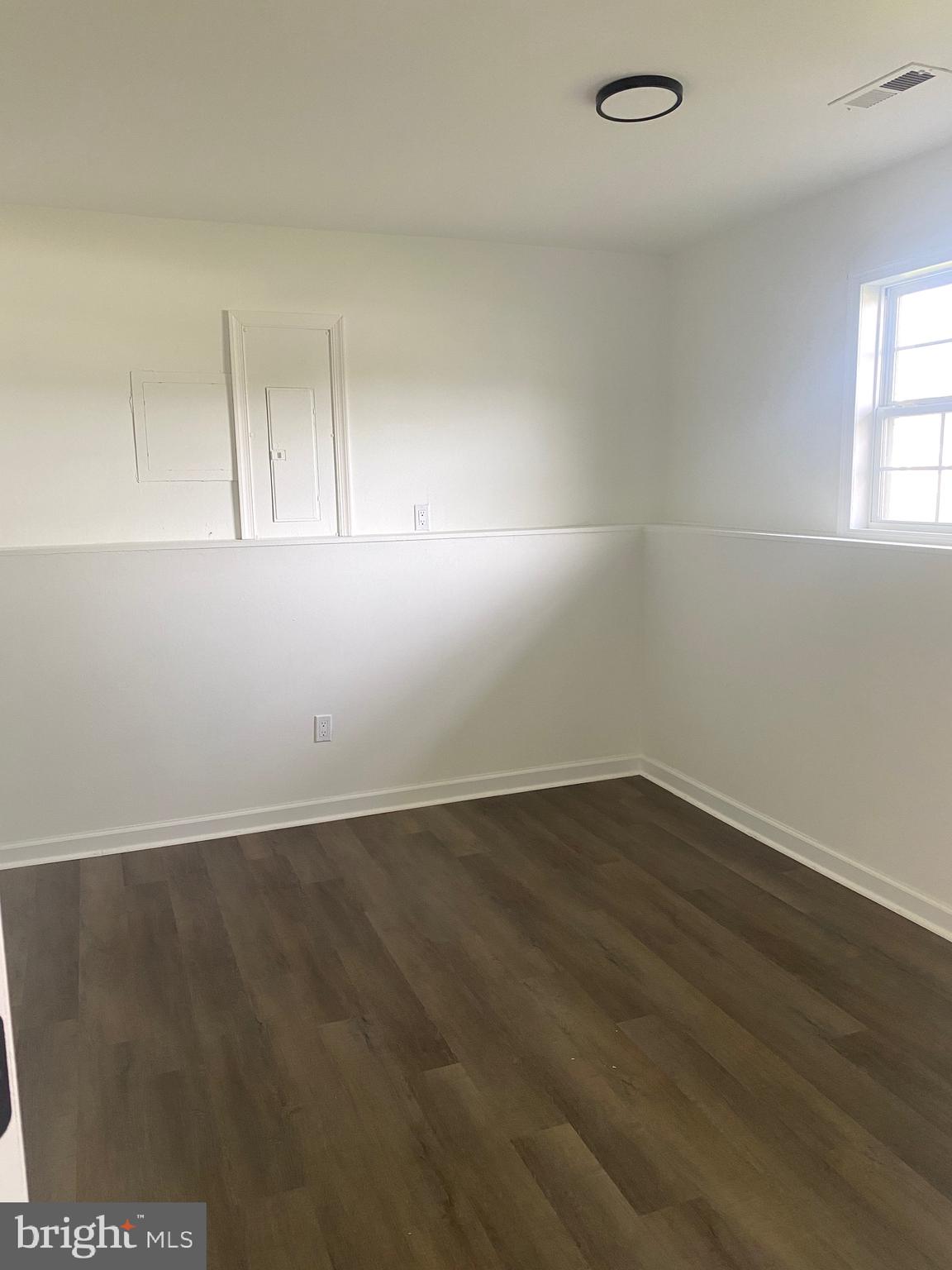 172 Jack Rabbit Lane Ranson, WV 25438 - Photo 29 of 34 an empty room with wooden floor and windows
