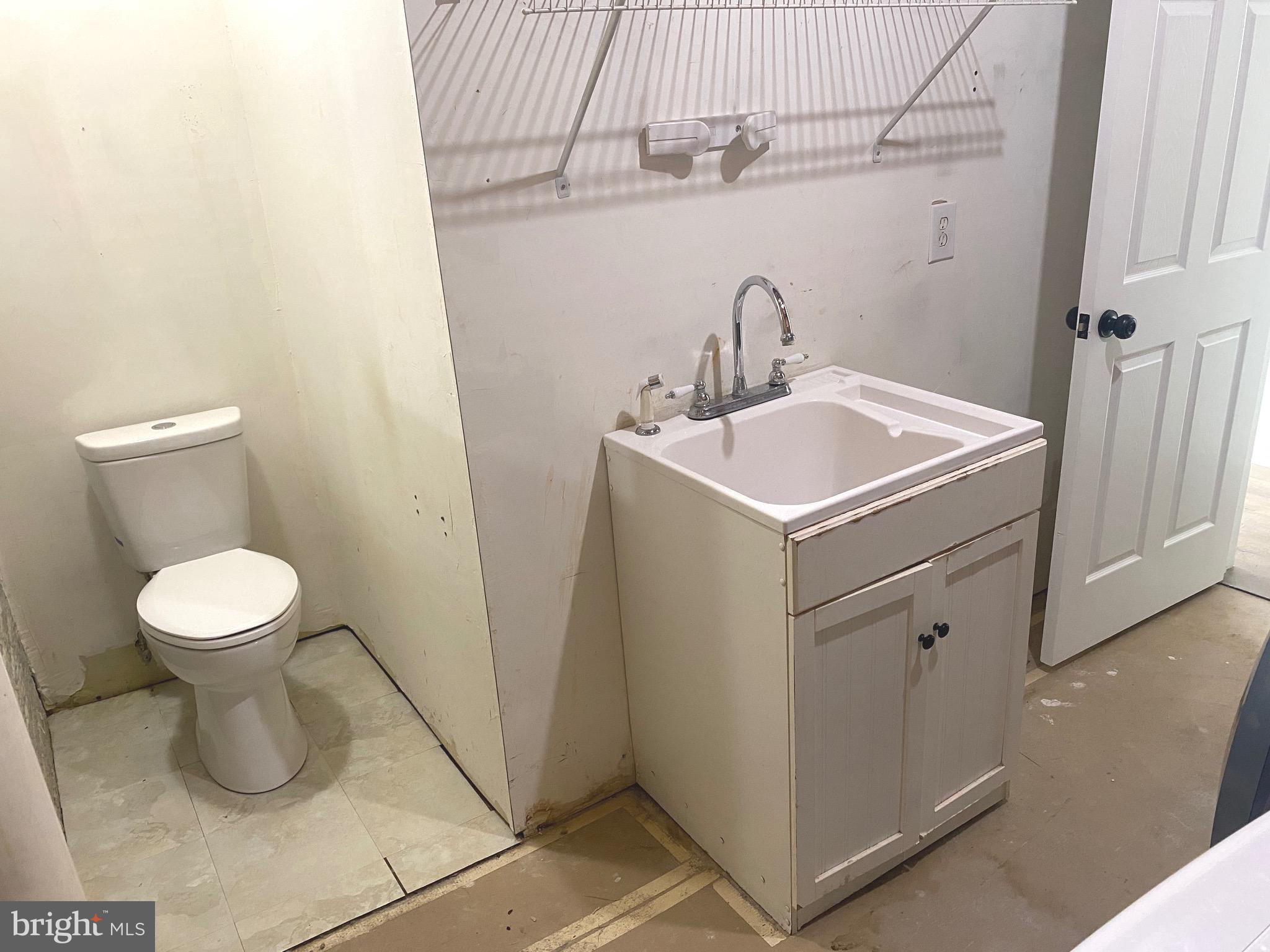 172 Jack Rabbit Lane Ranson, WV 25438 - Photo 33 of 34 a bathroom with a sink a toilet and a mirror
