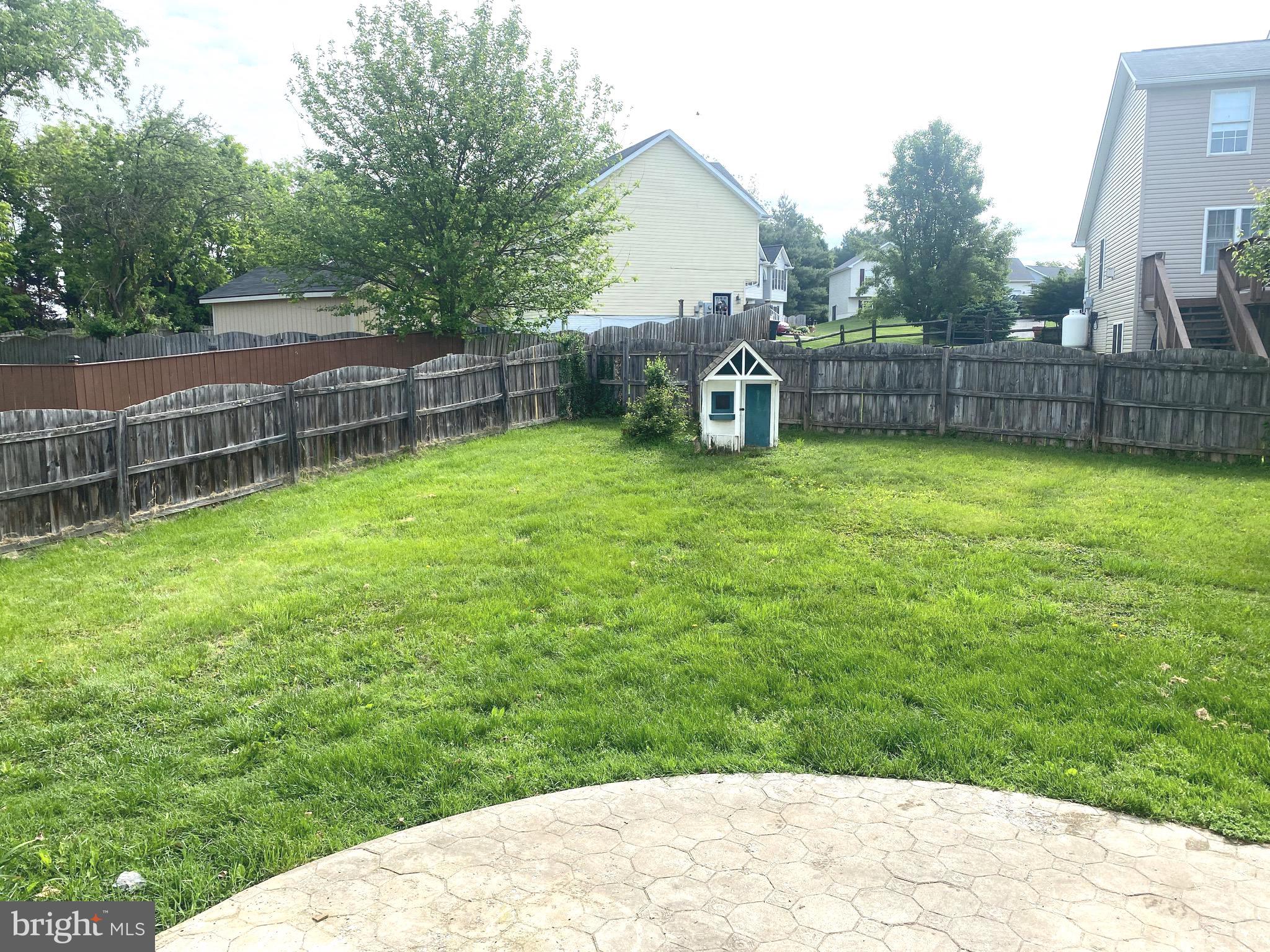172 Jack Rabbit Lane Ranson, WV 25438 - Photo 6 of 34 a backyard of a house with lots of green space
