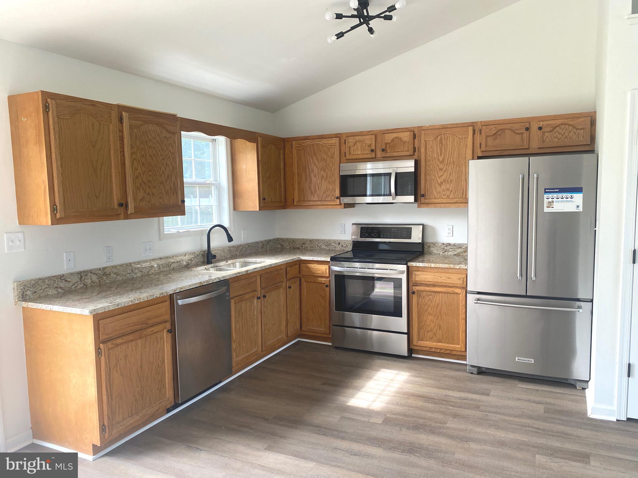 172 Jack Rabbit Lane Ranson, WV 25438 - Photo 8 of 34 a kitchen with a refrigerator stove and sink