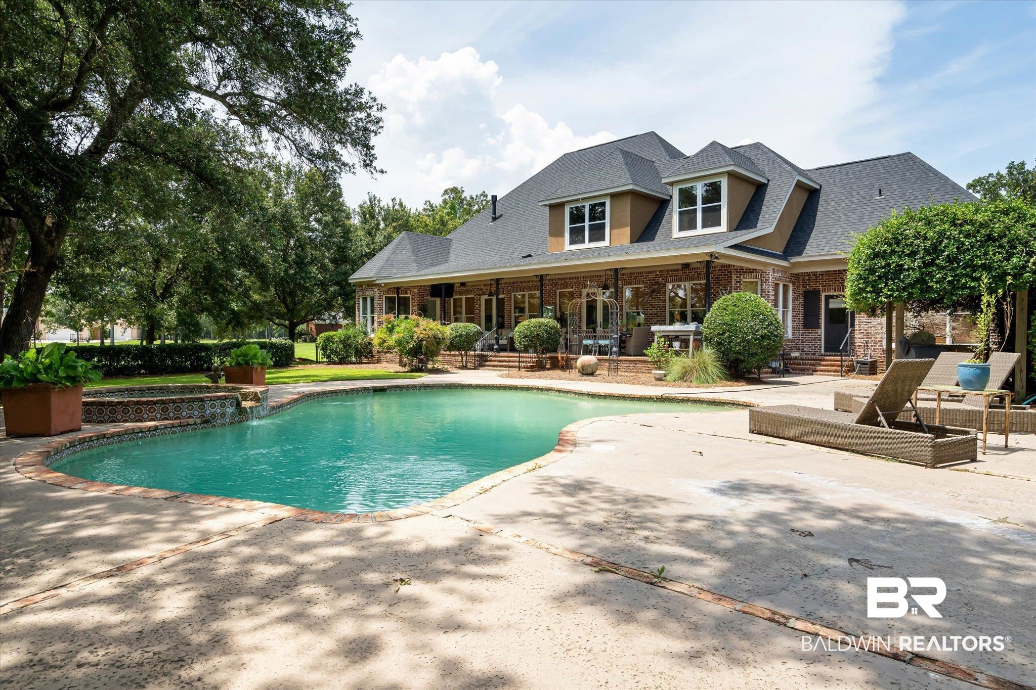 2905 Riverview Pointe Drive South Theodore, AL 36582 - Photo 25 of 44 Integrated pool / hot tub with a patio area