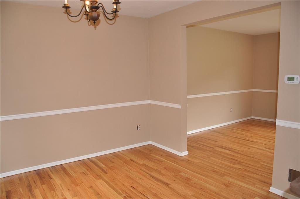 Diningroom,  livingroom combo which opens to the kitchen. All have refinished hardwood floors and new paint.