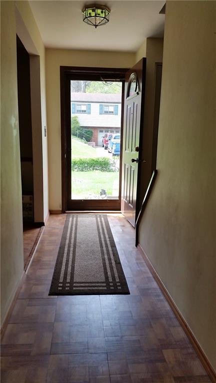 bright and large entrance way, leads to living room and kitchen.