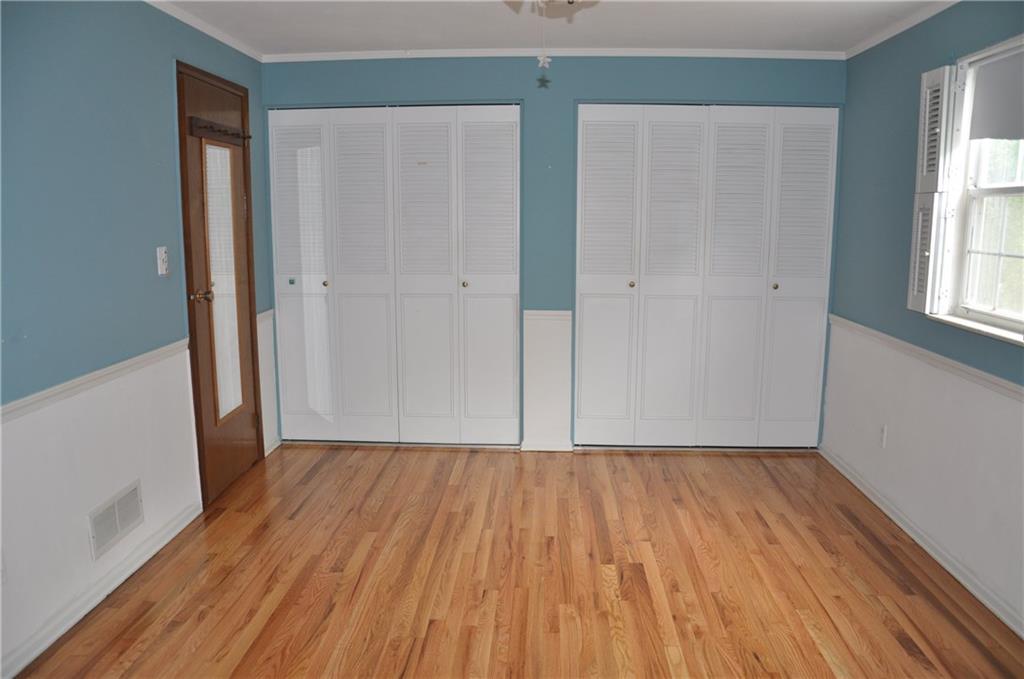 120 Rangley Drive Pittsburgh, PA 15209 - Photo 8 of 18 Master Bedroom with two closets, refinished hardwood floors add to the bright light clean room. Measures 16' x 11'