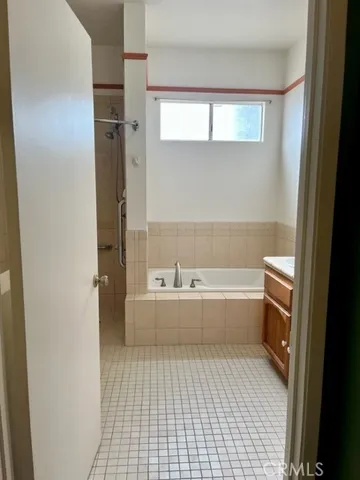 a bathroom with a shower and a shower
