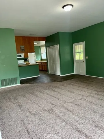 a kitchen with kitchen island a sink window and cabinets