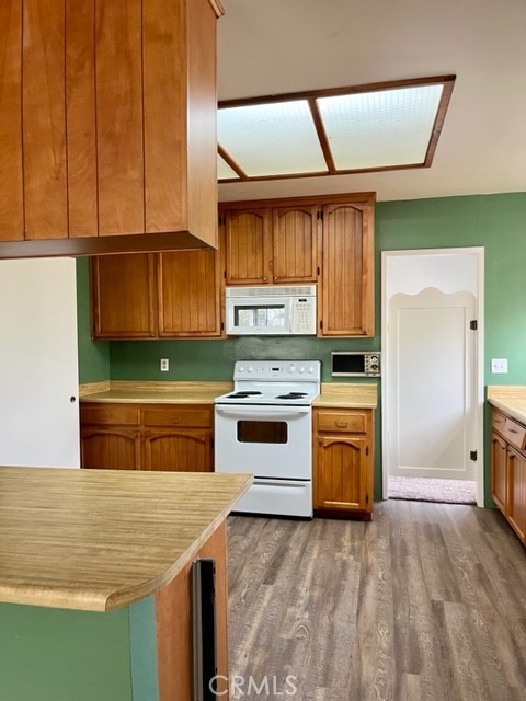 431 Chestnut Avenue Redlands, CA 92373 - Photo 21 of 23 a kitchen with stainless steel appliances granite countertop a stove a sink and a refrigerator
