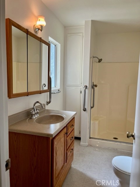 431 Chestnut Avenue Redlands, CA 92373 - Photo 9 of 23 a bathroom with a sink a toilet and a mirror