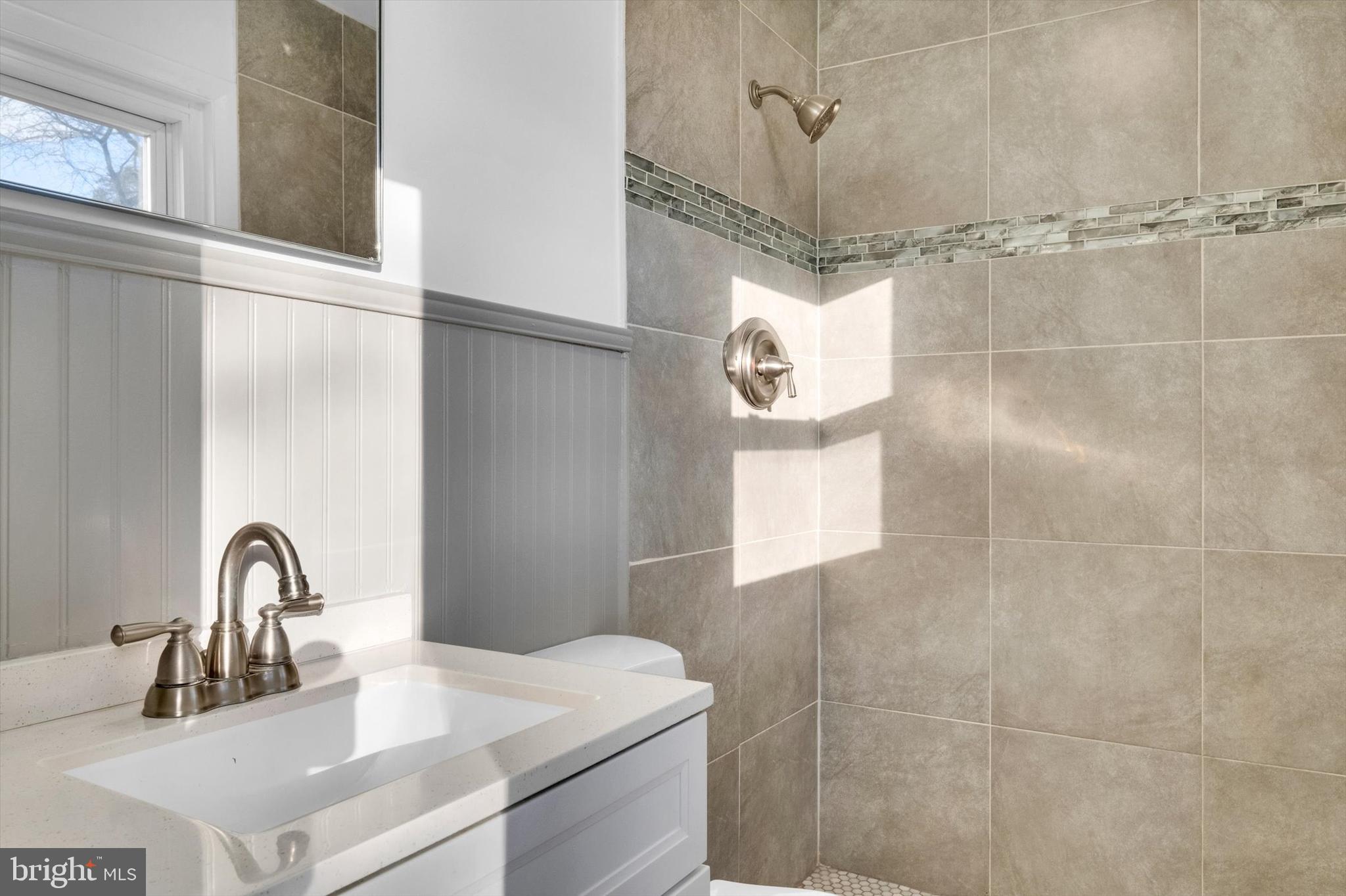 4224 Kinmount Road Lanham, MD 20706 - Photo 20 of 45 a bathroom with a sink and a mirror